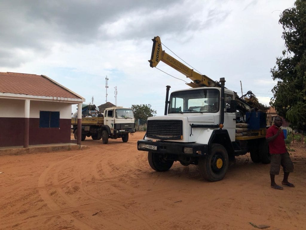 Trucks ready to drill the borehole at the Canchungo campus