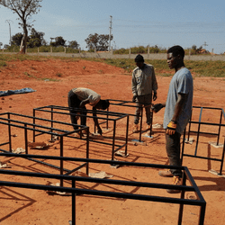 Welding students working on desks in West Africa