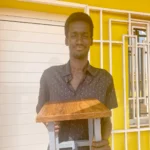 WAVS welding instructor, Dalton Da Silva, shows off one of the stools students made.